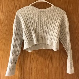 Cropped cable knit sweater